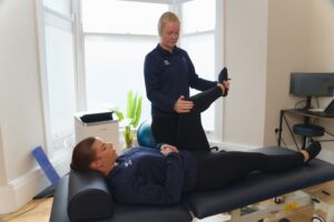 Patient with back pain being treated by Mollie at ProSport.