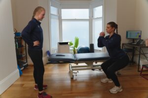 Knee pain patient with physiotherapist.