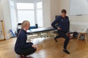 Prosport Physiotherapist with patient doing a lounge exercise.