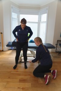 Physio with patient with ITB pain